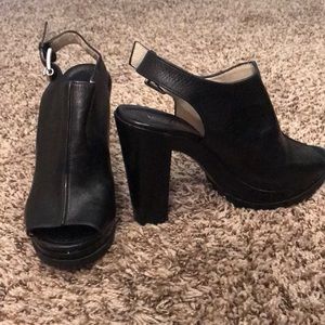 Black leather open toed closed foot heels